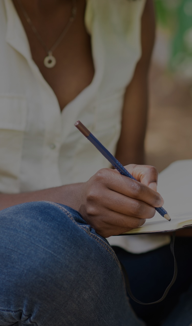 A woman writes down recovery tips.