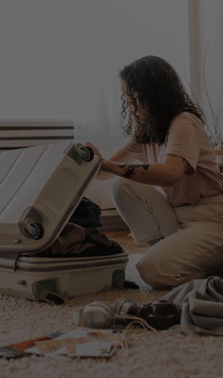 A woman packs her backs to prepare for a residential treatment program.