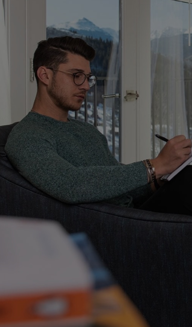 young man writing
