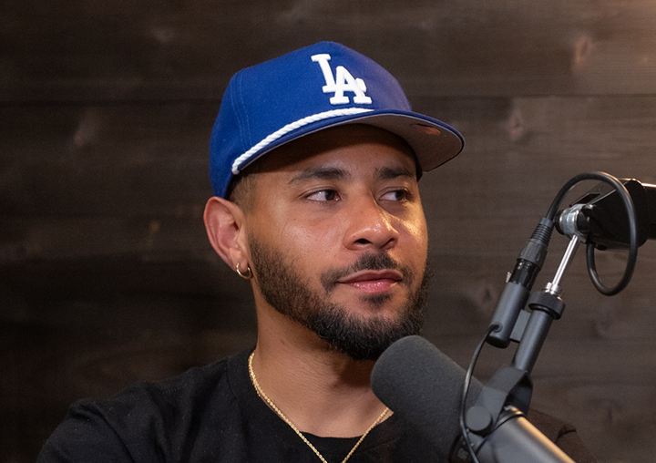 Justin Gilmore talks into a microphone on The Circle of M podcast.