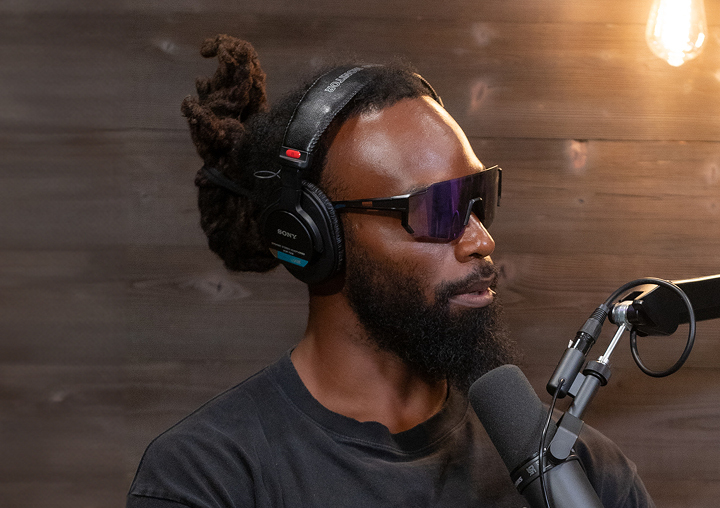 Soul Cole talks into a microphone on The Circle of M podcast.