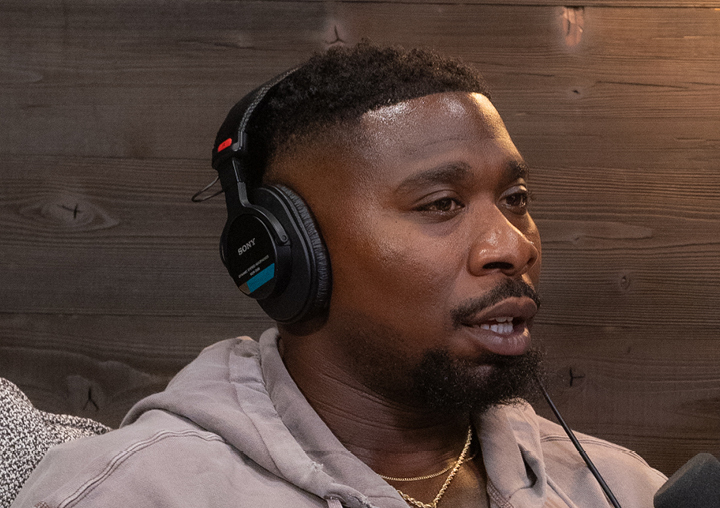 Zac Stacy talks into a microphone on The Circle of M podcast.