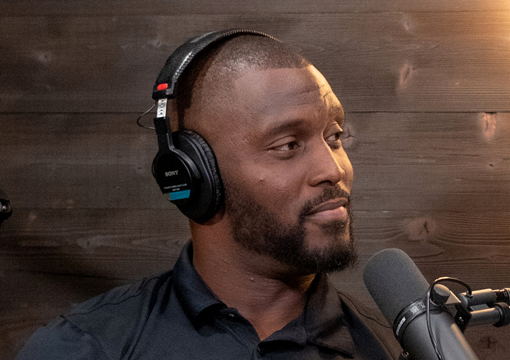 Orson Prince-Charles talks into a microphone on The Circle of M podcast.