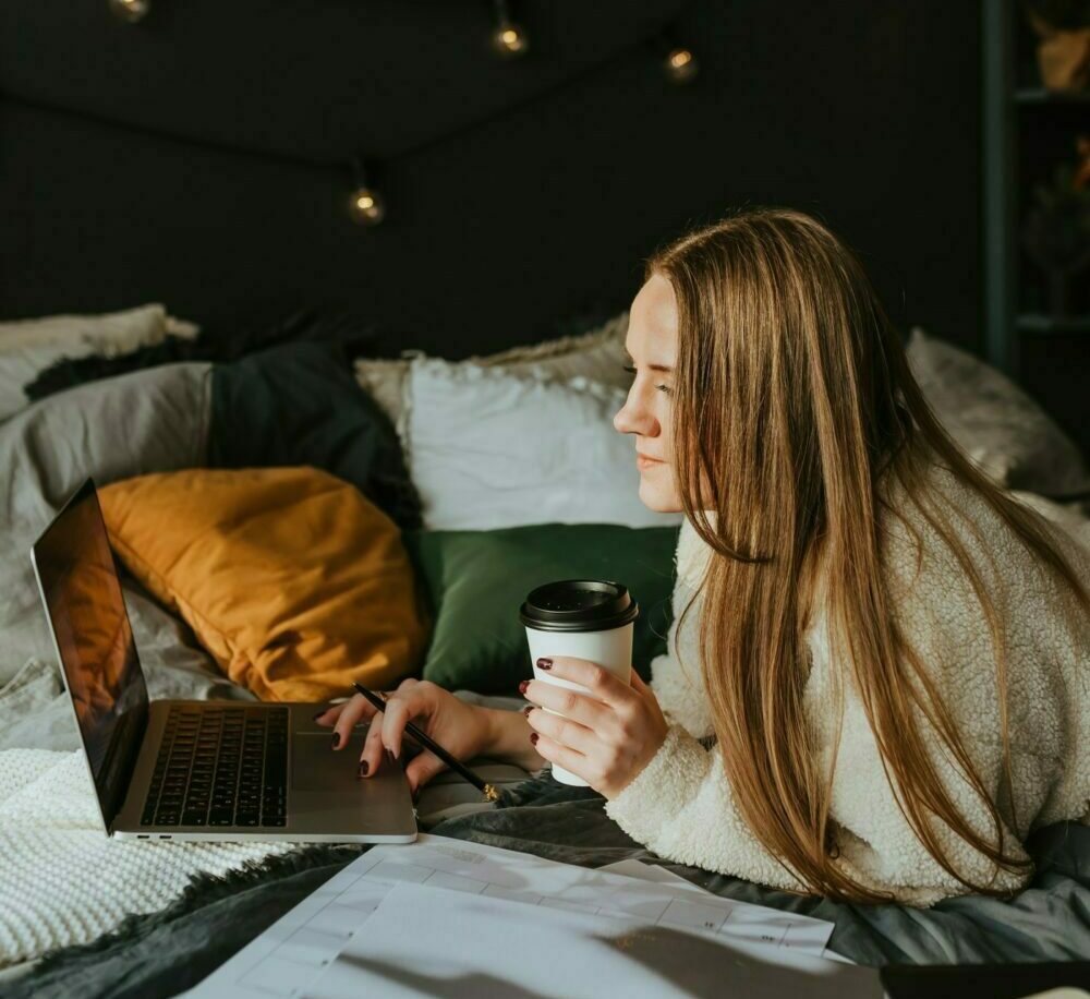 Woman with coffee on video chat