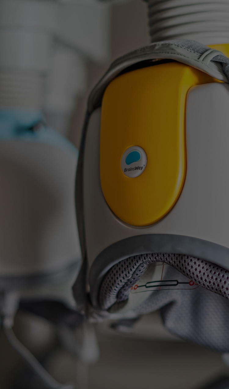 Closeup of yellow helmet used for deep transcranial magnetic stimulation