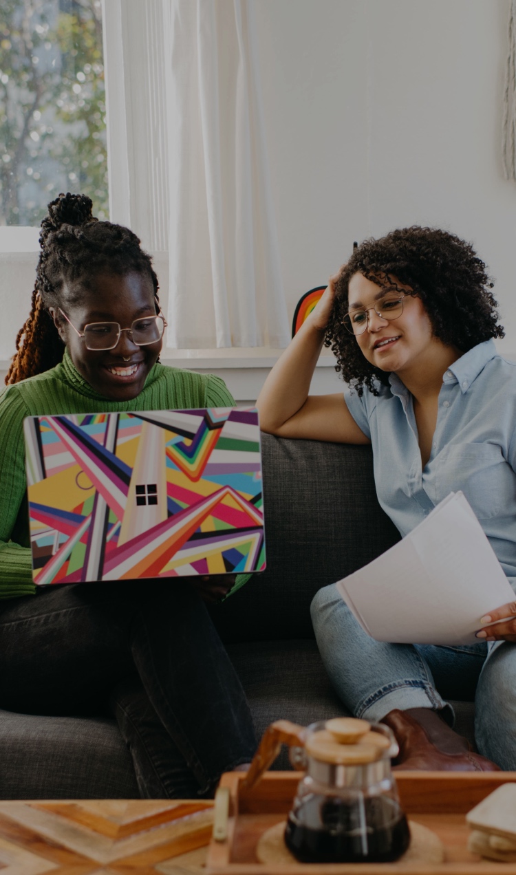 Two family members attend virtual family therapy from home.