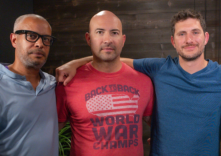 The hosts of the Harder Than Healing podcast stand together in the APN Lodge recording studio.