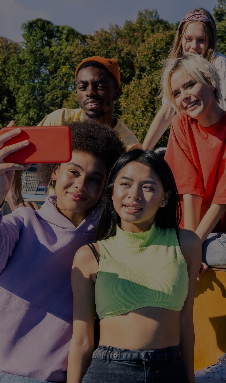 A group of friends takes a selfie together.