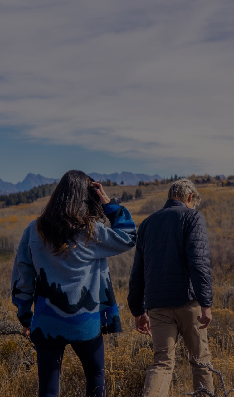 Two clients hike through the terrain near All Points North Lodge in Edwards, Colorado.