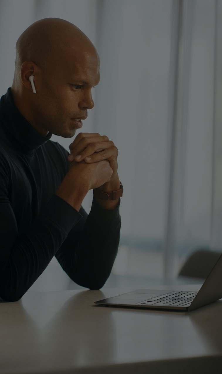 Man Accessing Professional Therapy on Zoom on His Computer