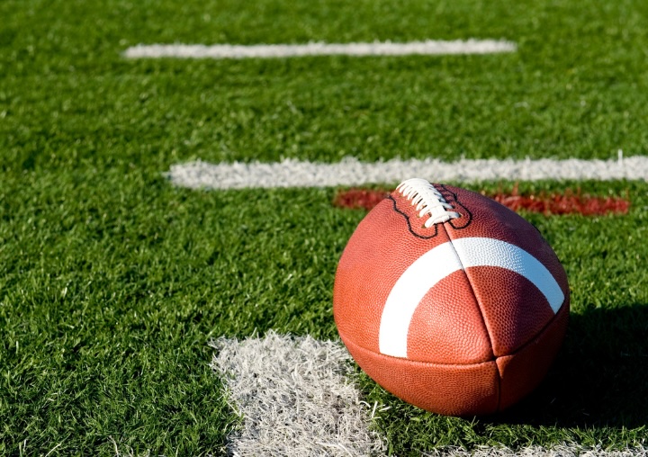 A football sits on the field.