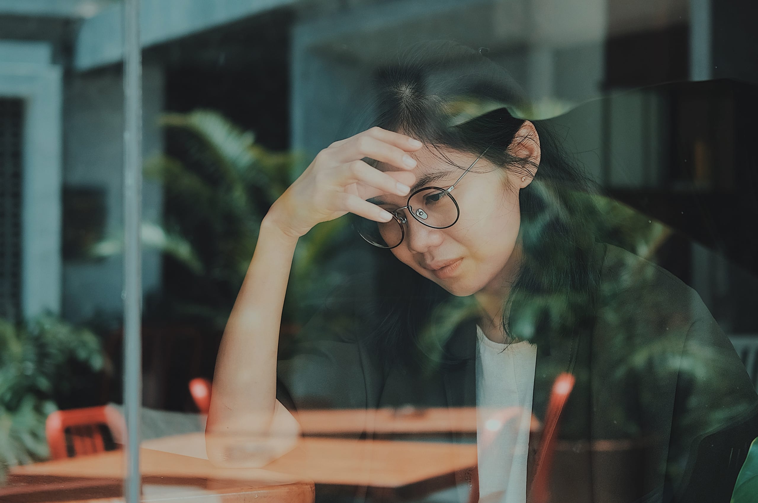 upset woman with hand on forehead