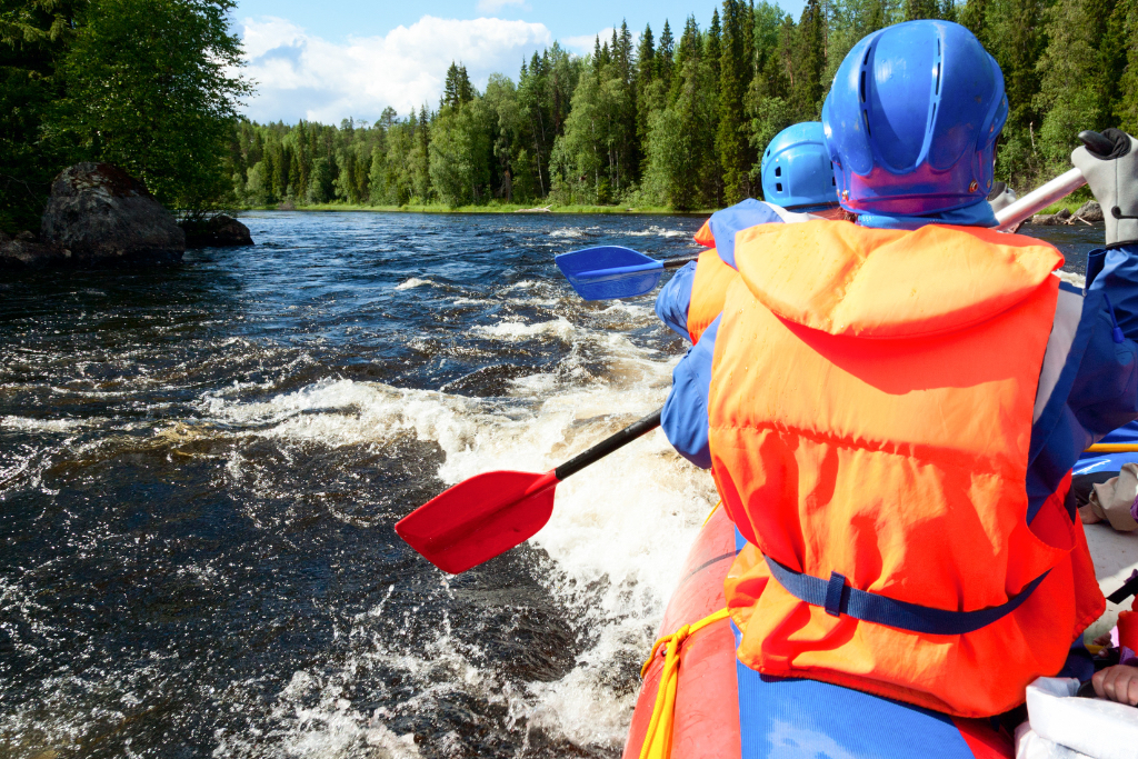 A group of whitewater rafters head downstream.
