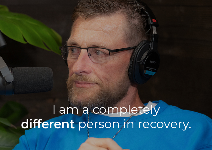 Dave speaking into a podcast microphone with a text overlay: I am a completely different person in recovery.