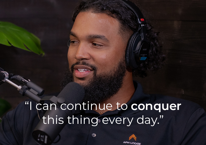 Marcus Smith speaking into a podcast microphone with a text overlay: I can continue to conquer this thing every day.