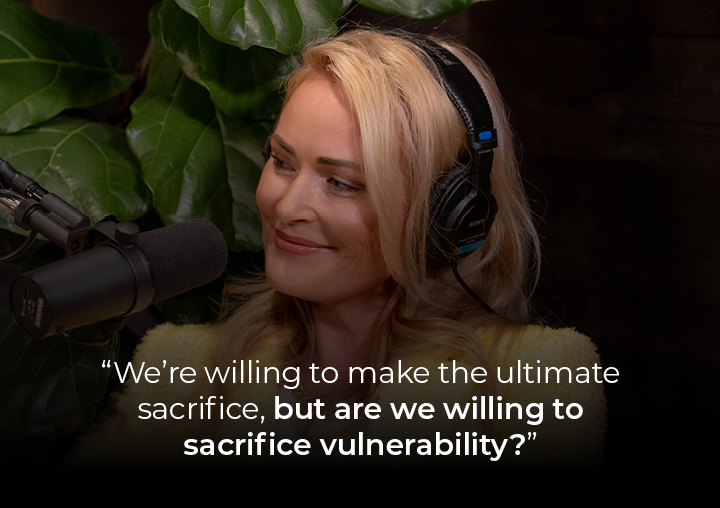 Elle speaking into a podcast microphone with a text overlay: We're willing to make the ultimate sacrifice, but are we willing to sacrifice vulnerability?