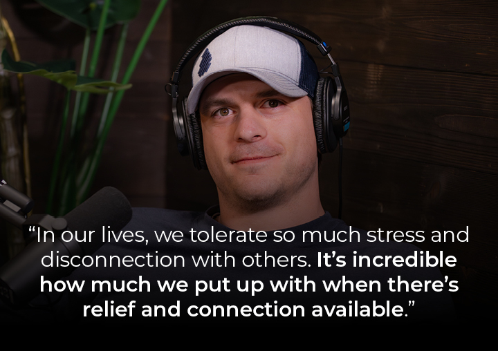 Stephen speaking into a podcast microphone with a text overlay: In our lives, we tolerate so much stress and disconnection with others. It’s incredible how much we put up with when there’s relief and connection available.