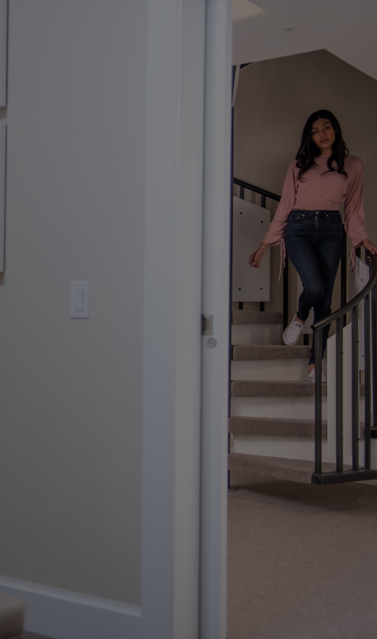 Woman Walking Down Stairs to Bedroom