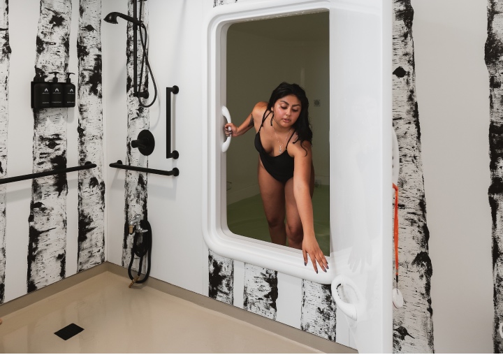 A client enters the sensory deprivation tank at All Points North Lodge.
