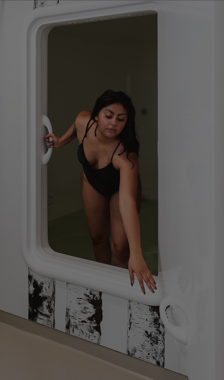 A client enters the sensory deprivation tank at All Points North Lodge.