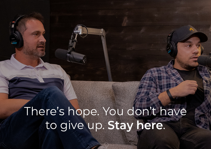 Andy and Dave sitting on a couch listening to the podcast guest with a text overlay that says There is hope. You don't have to give up. Stay here.