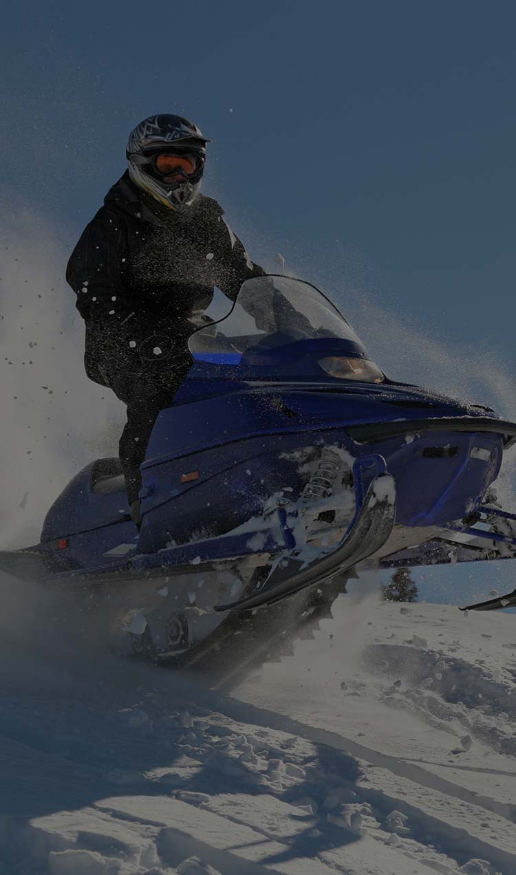 person riding a snowmobile