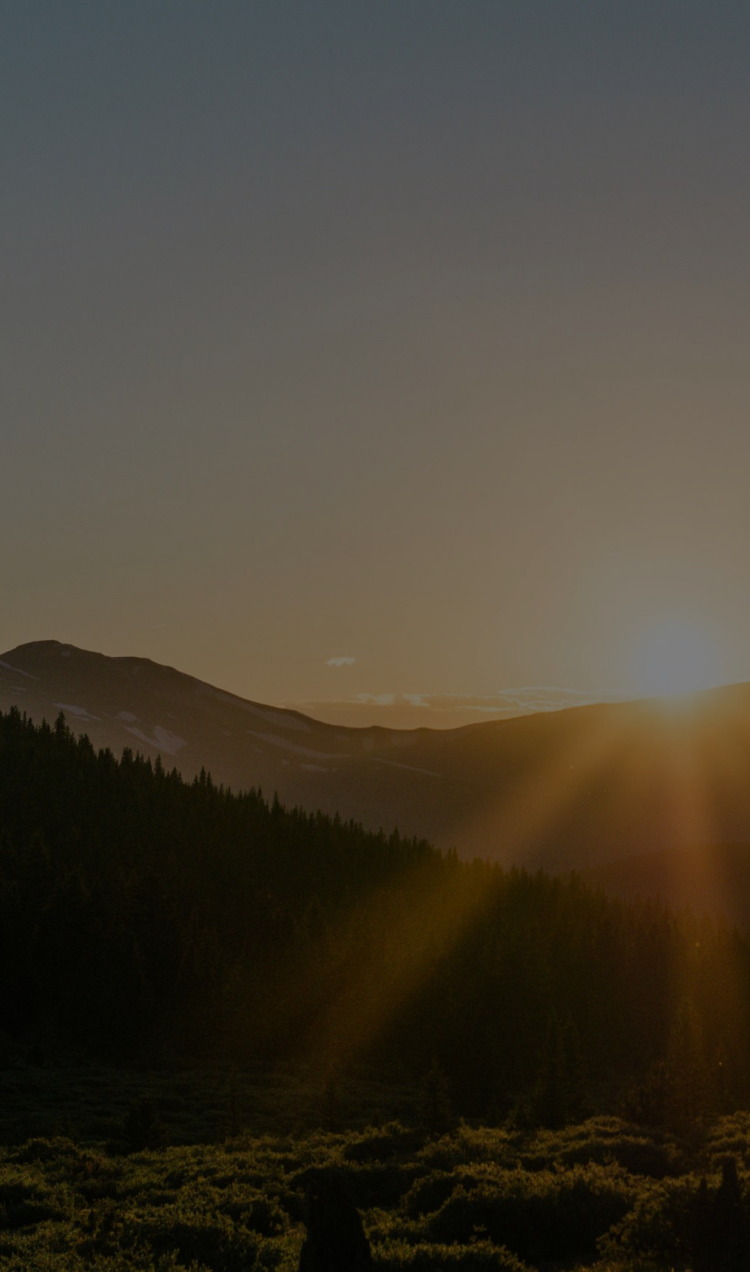Sunrise breaking over the mountains in Colorado.