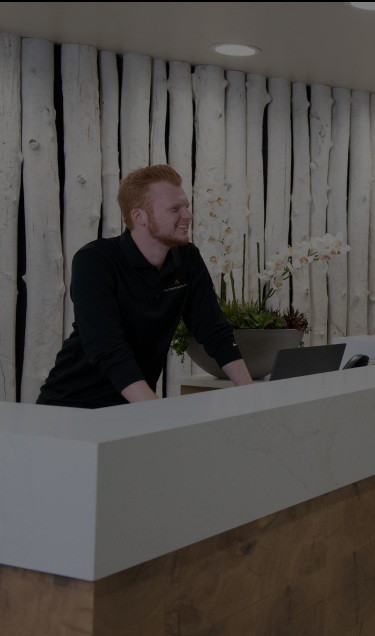 An All Points North Lodge employee greets clients at the Wellness Wing.
