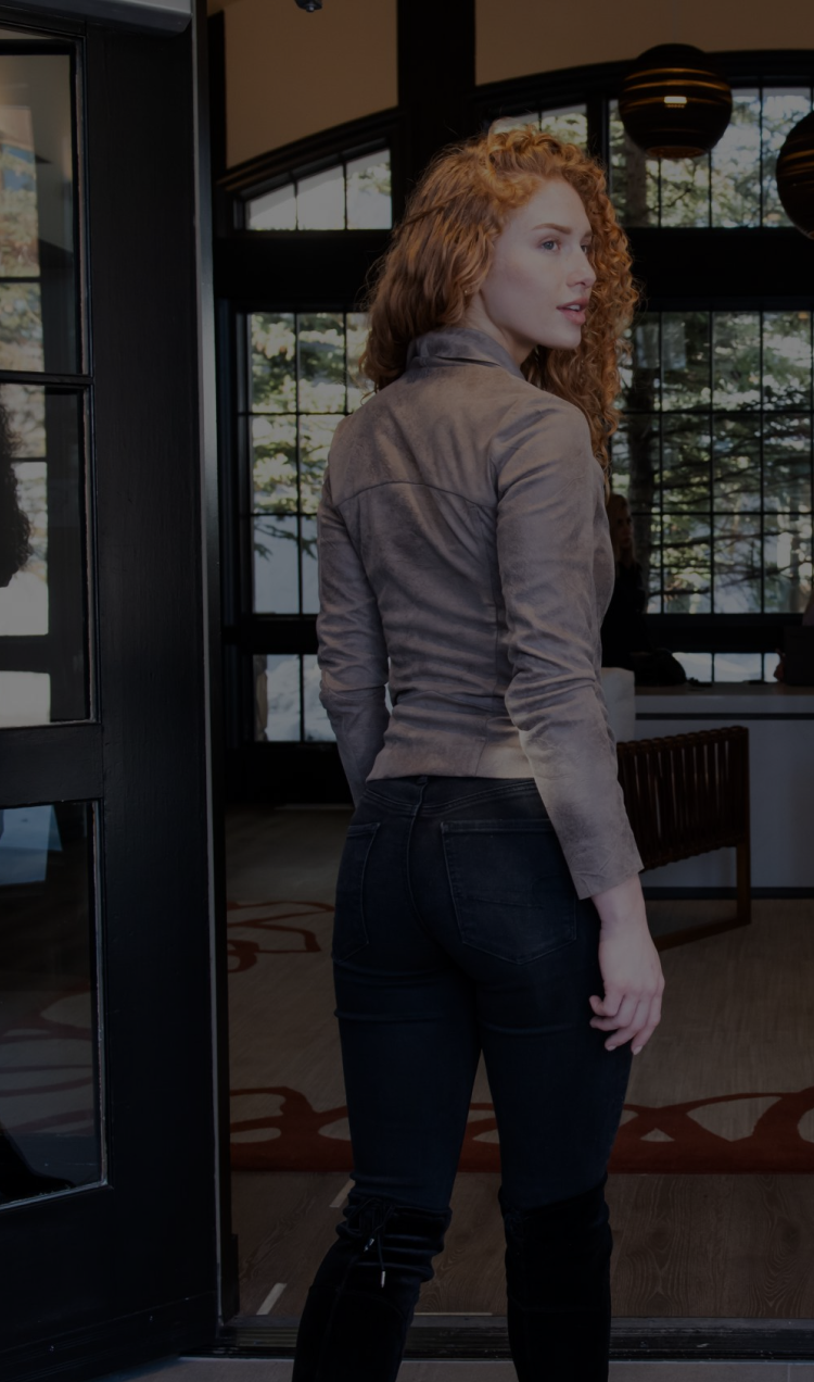 A client walking into the lobby at All Points North Lodge.