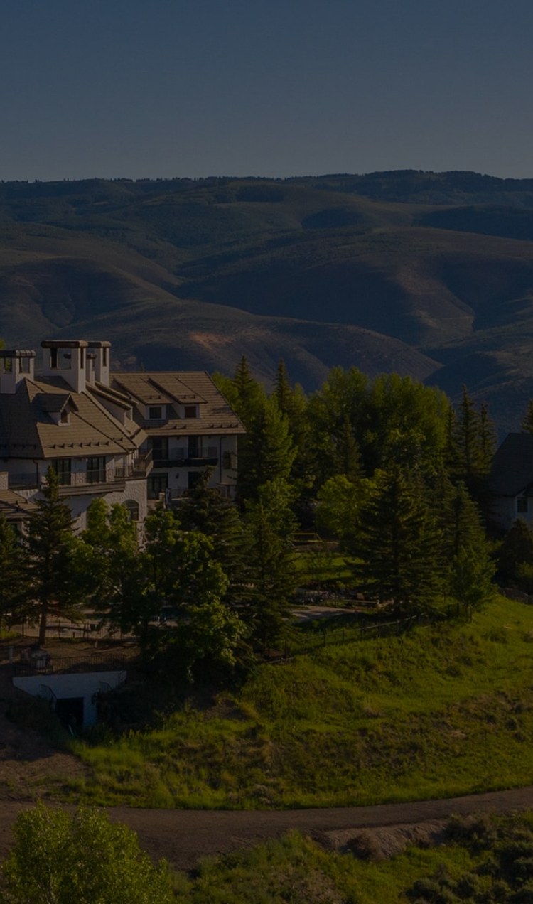 A landscape aerial photo of All Points North Lodge in the summer.