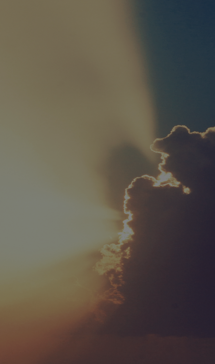 A sunbeam breaks through a cloud.