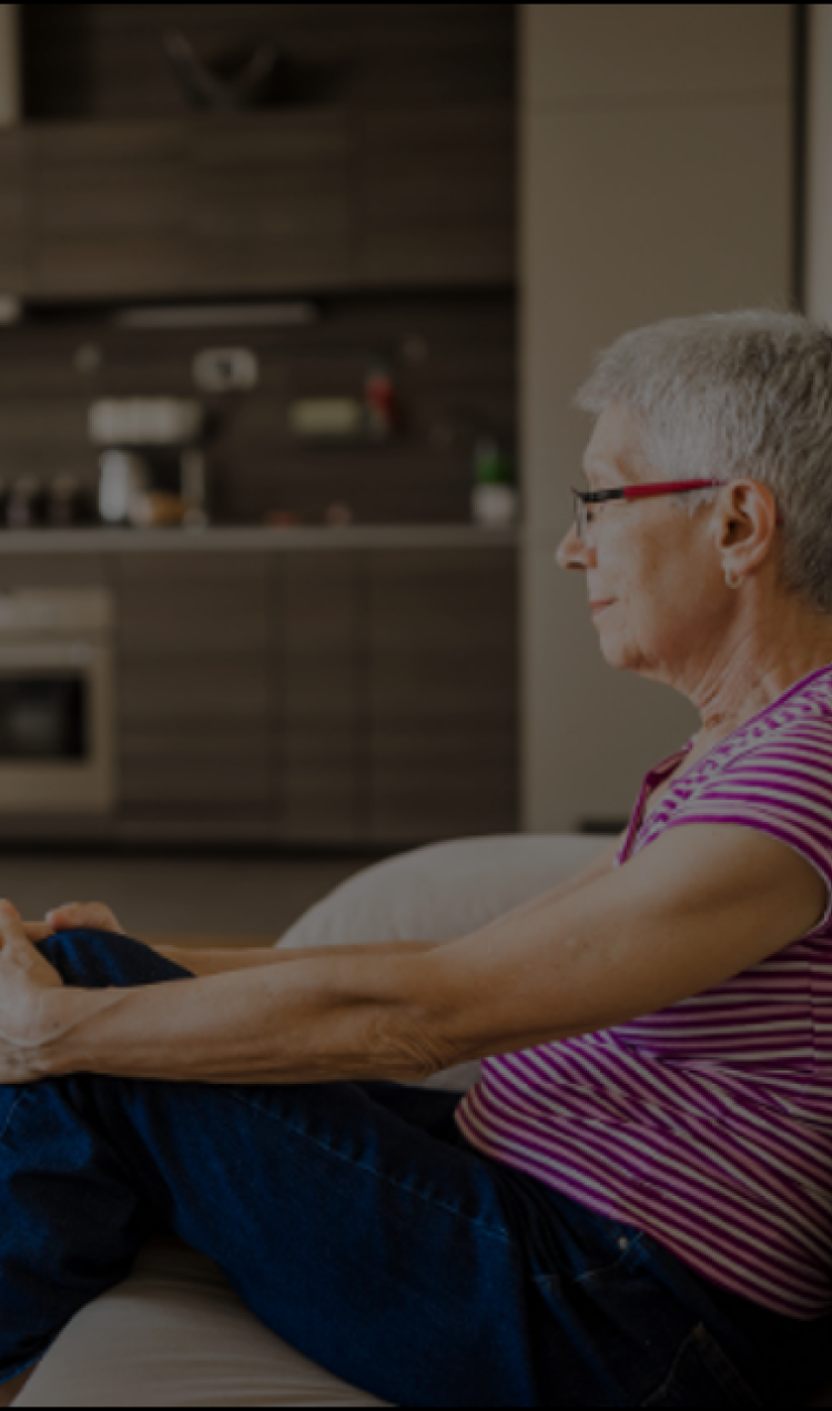 senior citizen undergoing online trauma therapy